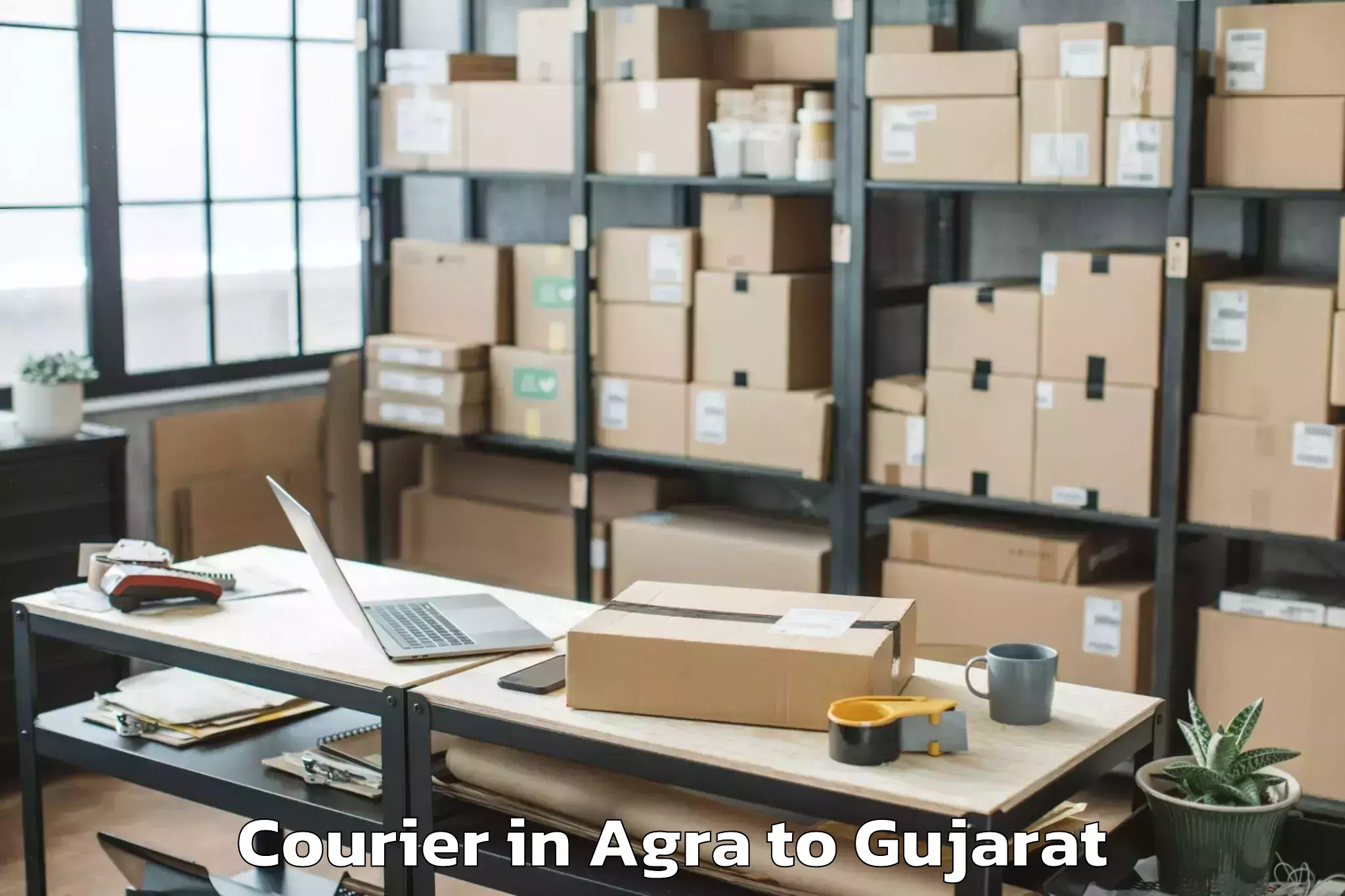 Book Agra to Songadh Courier Online